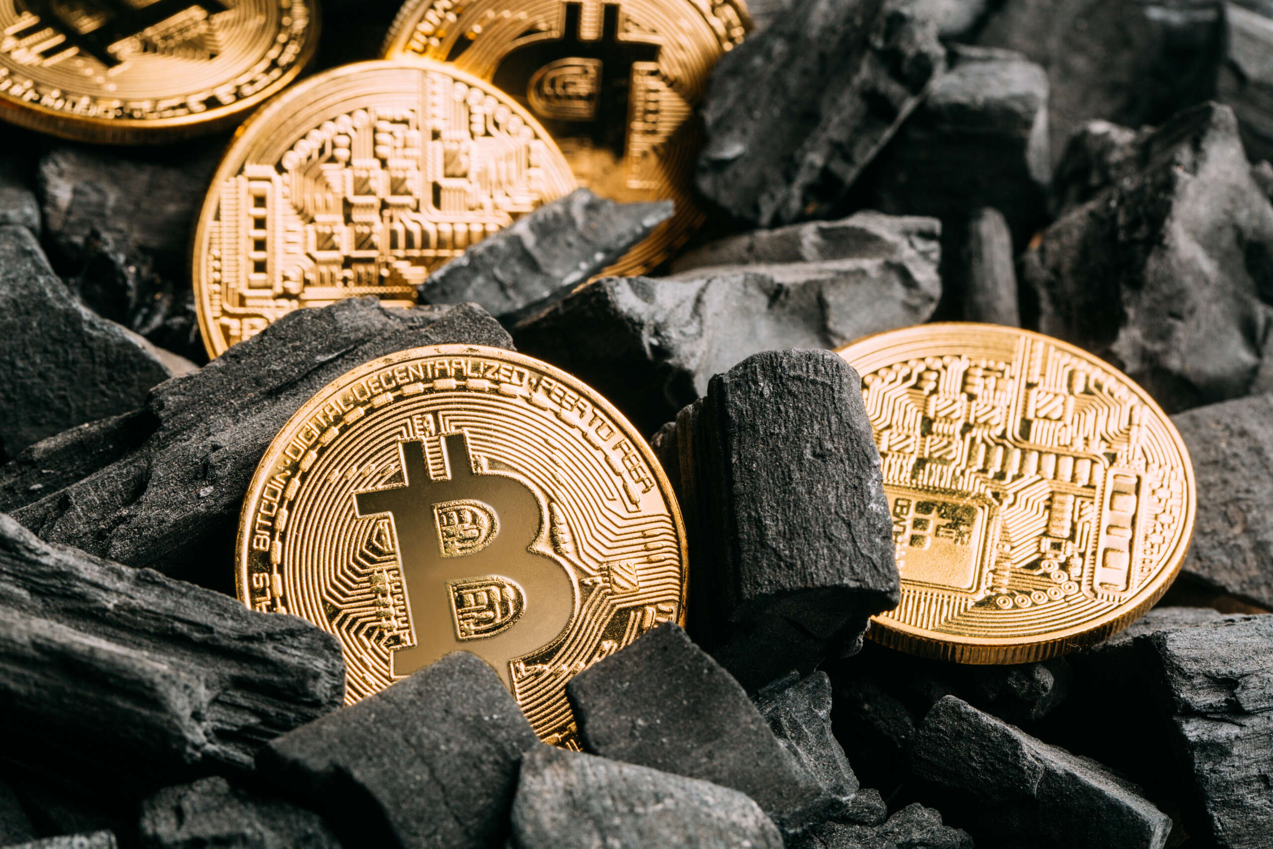 bitcoins-on-coal-background-2022-03-04-06-08-29-utc-scaled.jpg