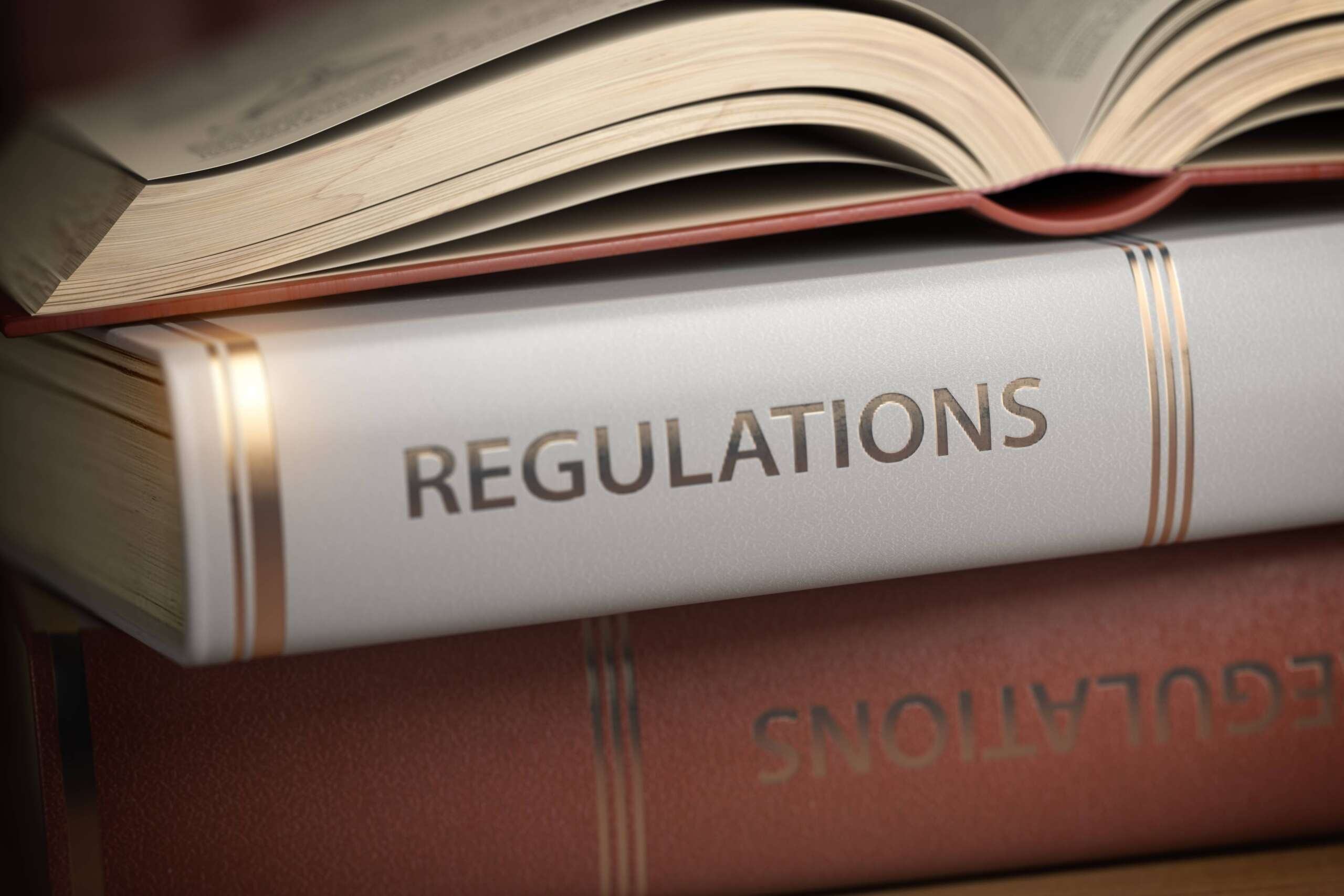 regulations-book-law-rules-and-regulations-conce-2021-08-26-16-57-04-utc-1-scaled.jpg